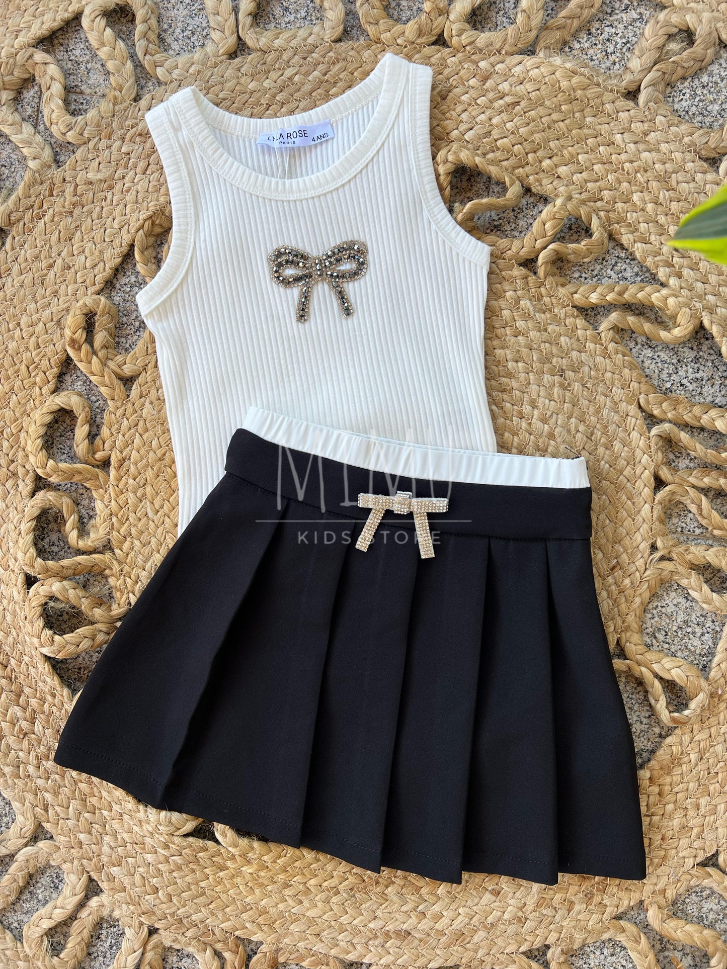 Pleated skirt with bow and ribbed bow top (items purchased individually)