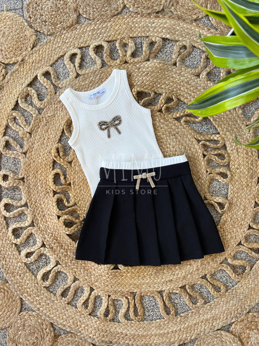Pleated skirt with bow and ribbed bow top (items purchased individually)