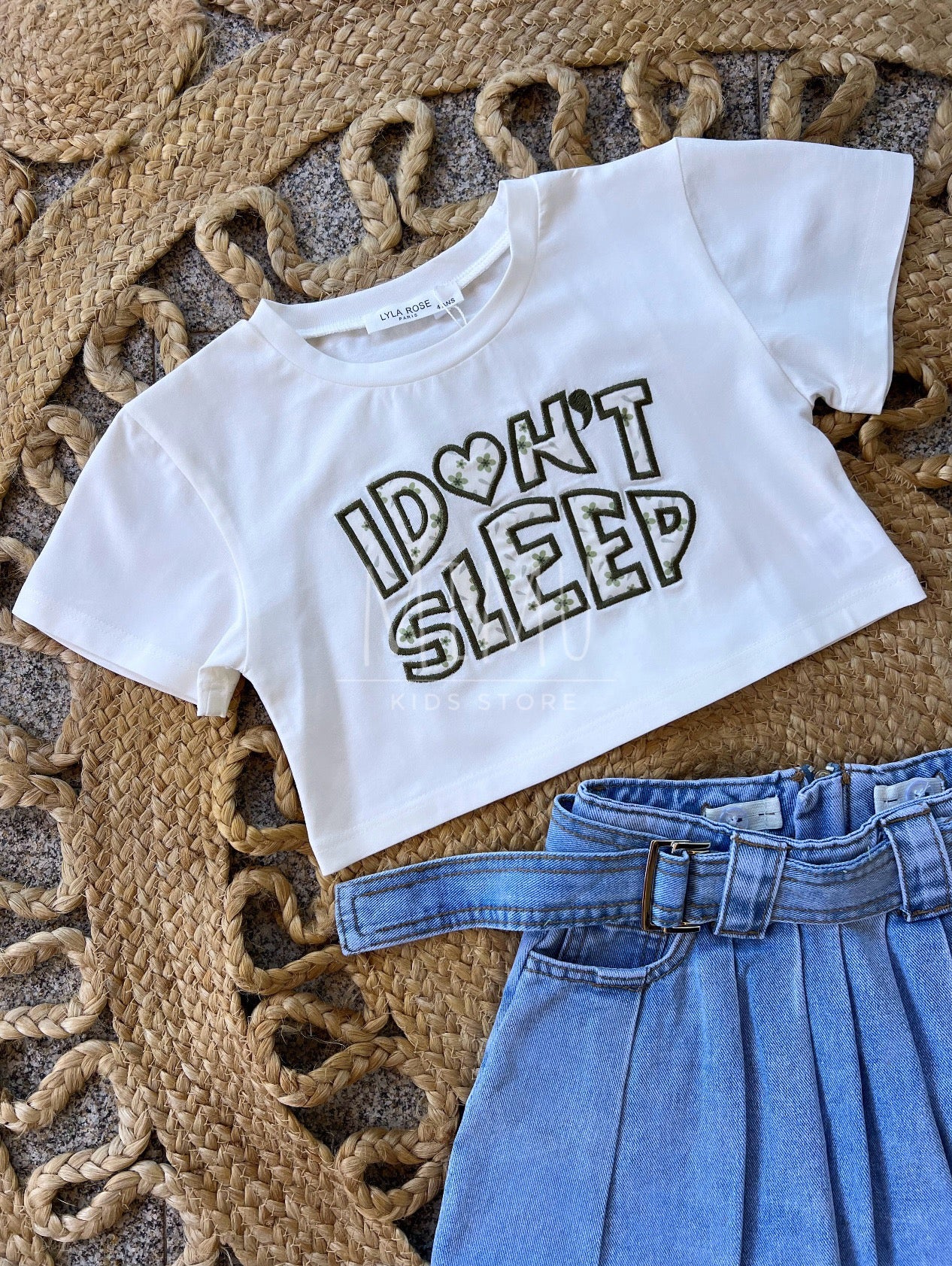Denim skirt with pleats and Cropped “I don't sleep” T-shirt (items purchased individually)