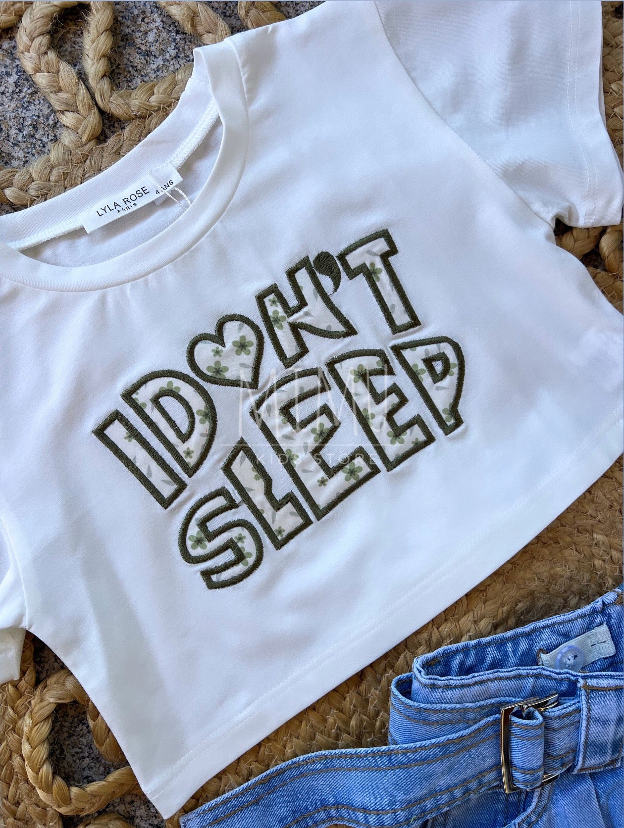Denim skirt with pleats and Cropped “I don't sleep” T-shirt (items purchased individually)