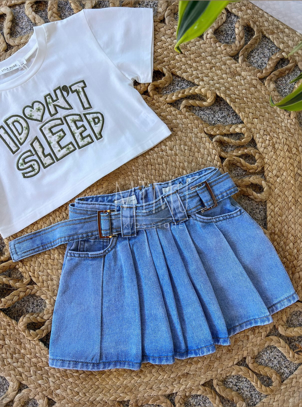 Denim skirt with pleats and Cropped “I don't sleep” T-shirt (items purchased individually)